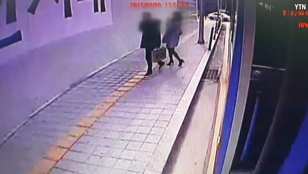 The man and woman had just stepped off a bus at a transport hub in the capital Seoul when the drama unfolded