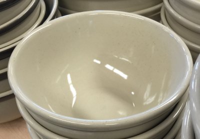 Two clear glaze cups show the color and glaze fit differences between feldspar and kaolin