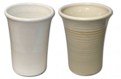 Two clear glaze cups show the color and glaze fit differences between feldspar and kaolin