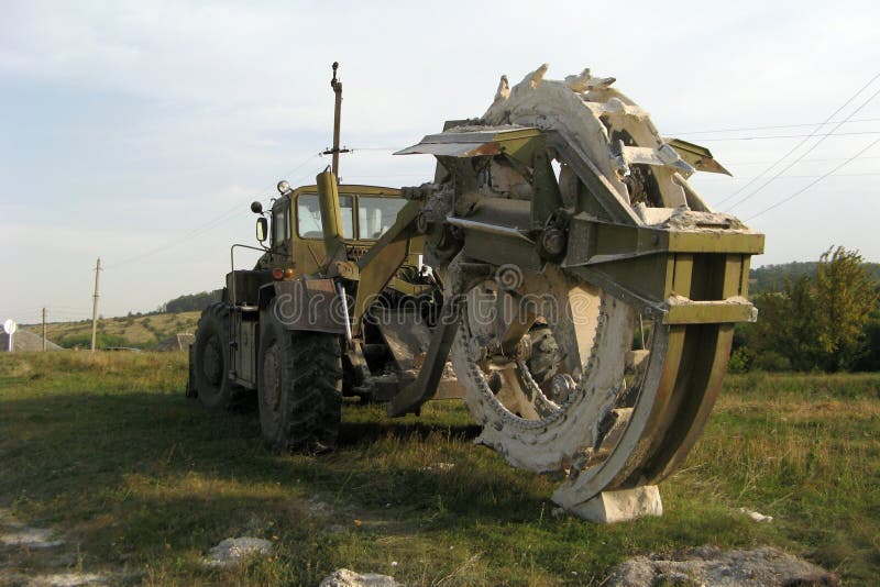 Khaki Color Massive Trench Machine. Massive trench machine, khaki color with black tires stock photos