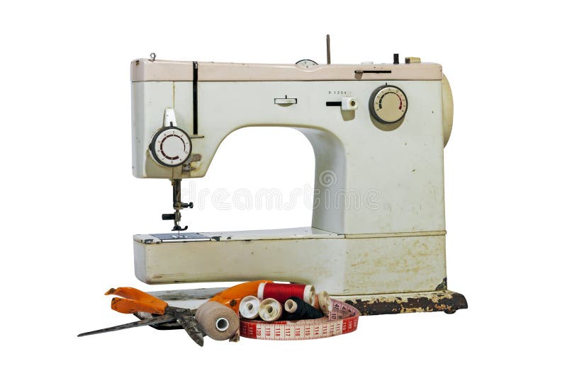 Old Rusty Vintage Sewing Machine with Cotton and Scissors. Old rusty vintage sewing machine with cotton reels, grungy scissors and tape measure on white stock photos