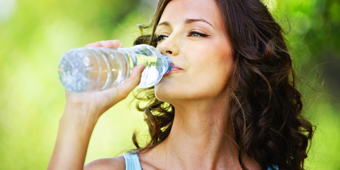 Woman Drinking From Water Bottle